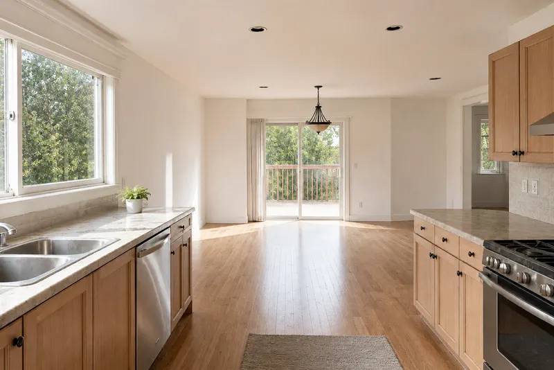The same kitchen after cleaning: clear counters and gleaming floors